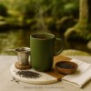 Tasse kaki Kyoseitea en exposition avec infuseur